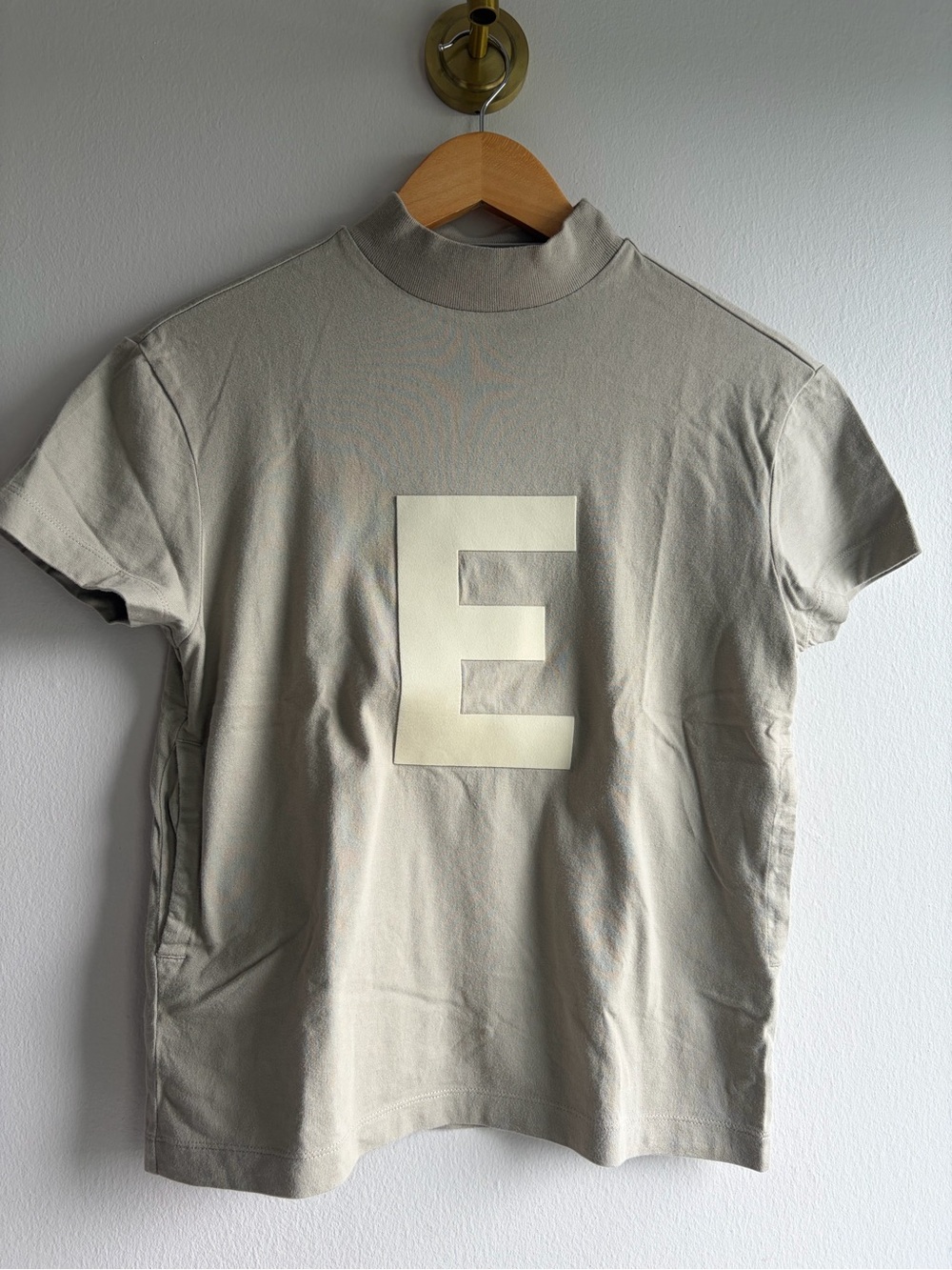 Fear of God Short Sleeve Tee in Light Beige with Cream 'E' Graphic